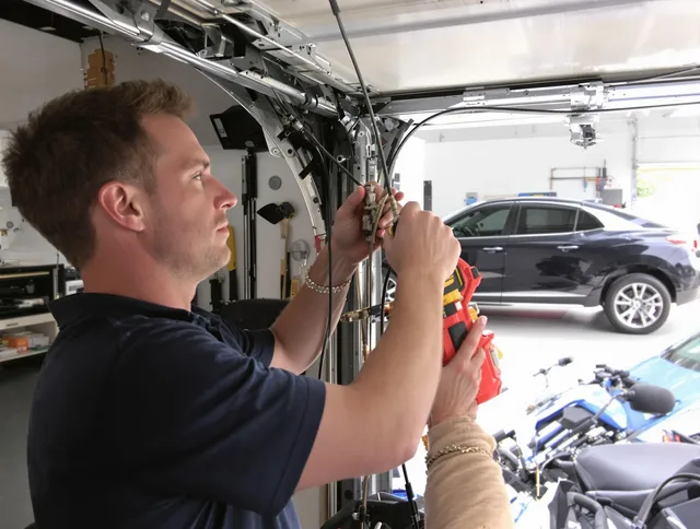 Manhattan Beach Garage Door Repair safety certified technician performing cable replacement in Manhattan Beach