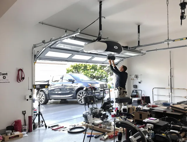 Manhattan Beach Garage Door Repair specialist installing smart garage door opener system in Manhattan Beach home